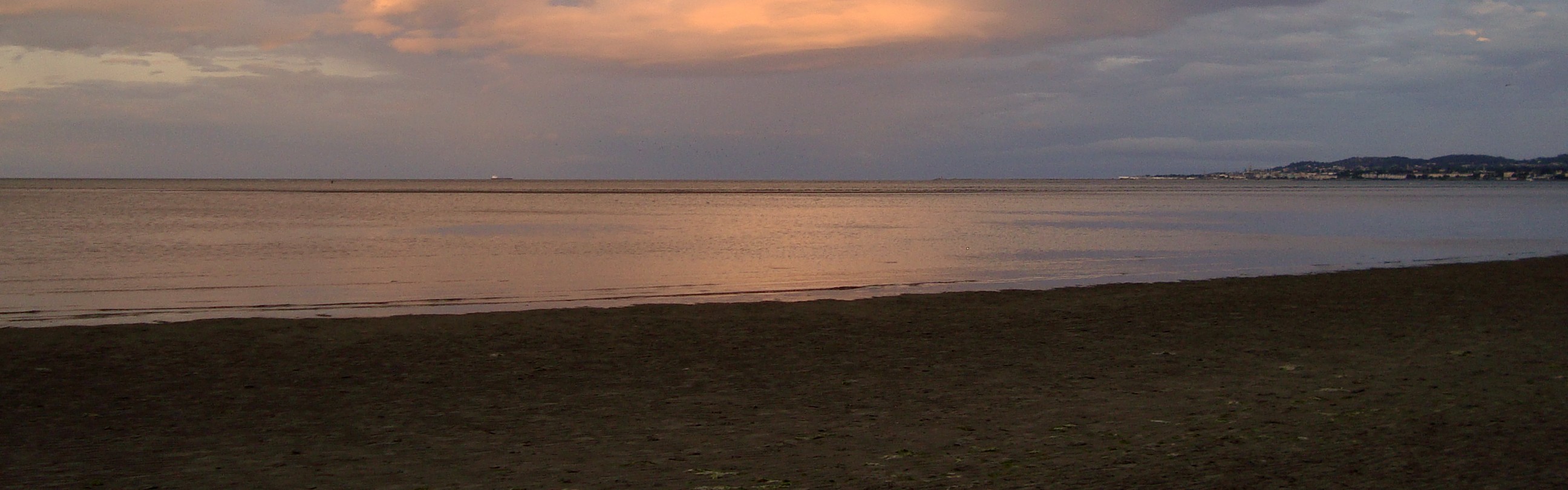 Sunset over the shoreline of Dublin Bay